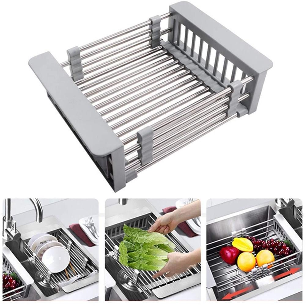a stainless steel sink rack holding plates, fruits and vegetables